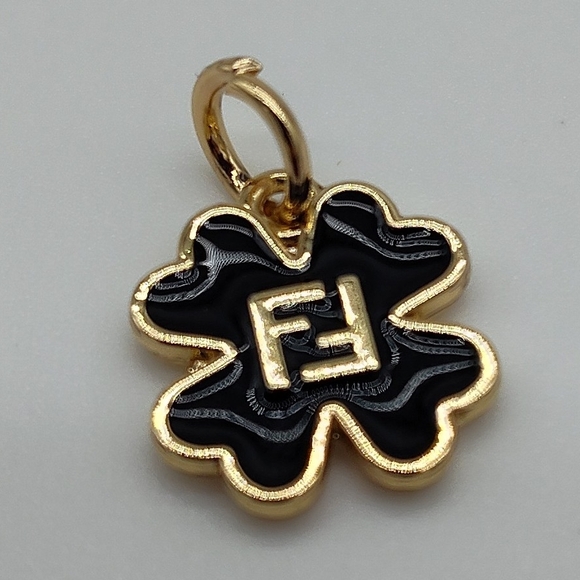Fendi Jewelry - FENDI Black Enamel Clover Charm Gold Tone FF Logo Pendant